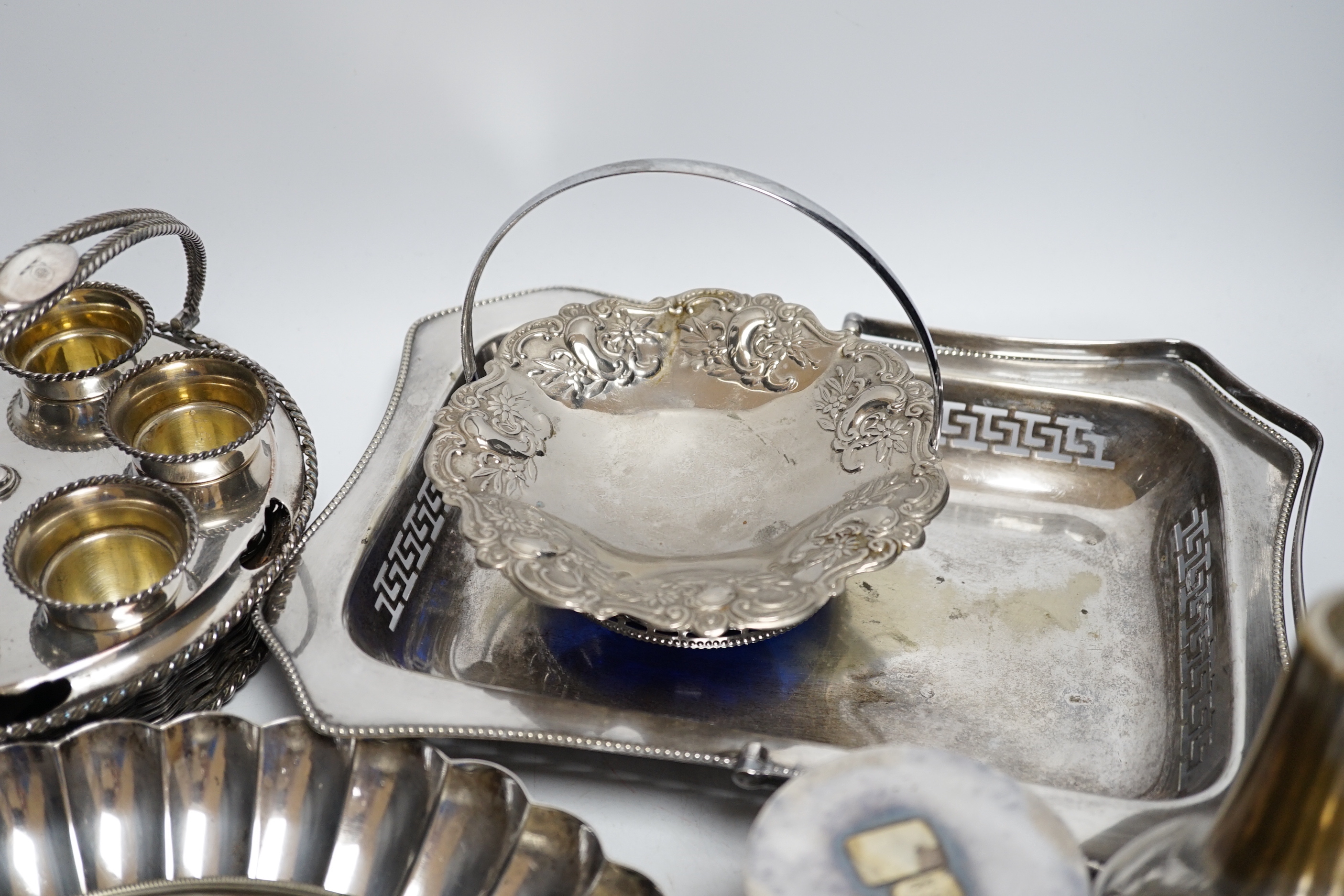 A plated egg cruet and sundry plate